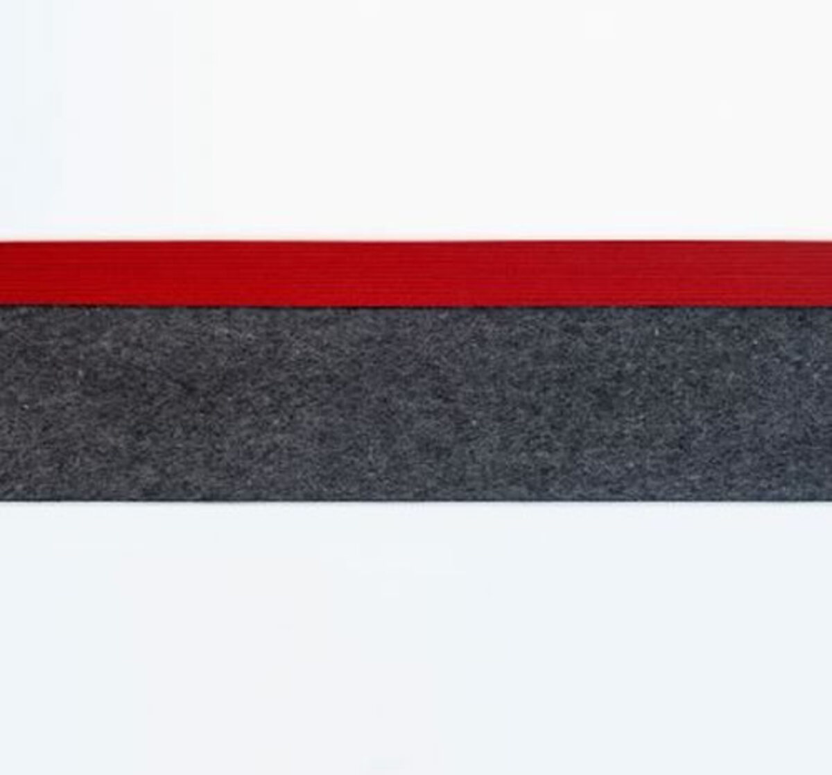 Horizontal composition featuring three bands of color: white at top and bottom framing a red stripe above a textured dark gray or charcoal band, creating a minimalist abstract arrangement with a tactile, felted material quality.