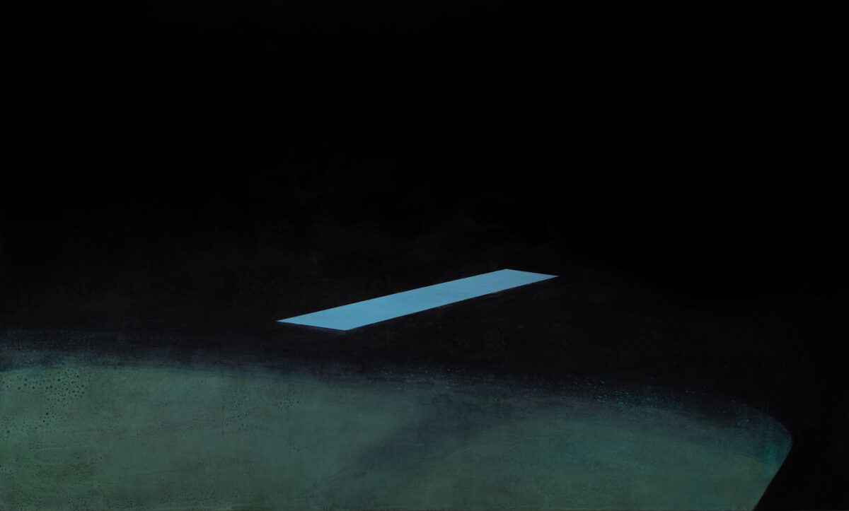 A luminous blue rectangular form hovers against a dark background, its sharp edges contrasting with the soft, textured greenish-gray terrain below. The composition emphasizes isolation and minimalism, with the glowing shape suspended in deep shadow.