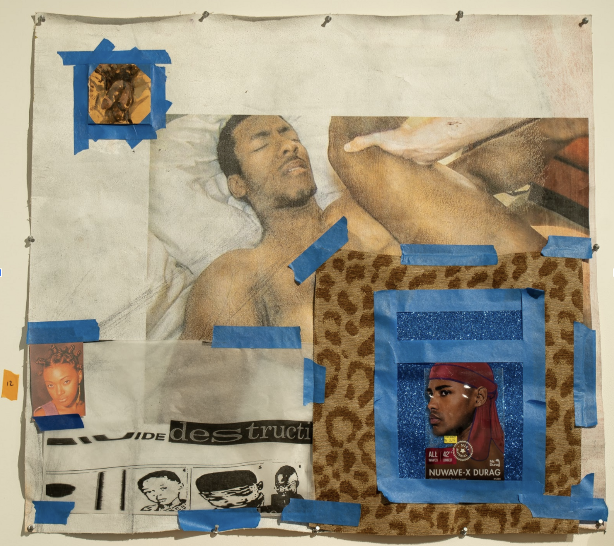 A mixed-media collage on canvas featuring a reclining male figure in earthy tones positioned alongside various cut-out printed images and materials held in place with blue tape. Leopard-print fabric, magazine clippings, and small portrait photographs are layered and taped across the composition, creating a fragmented, assembled aesthetic with contrasting warm and cool tones.