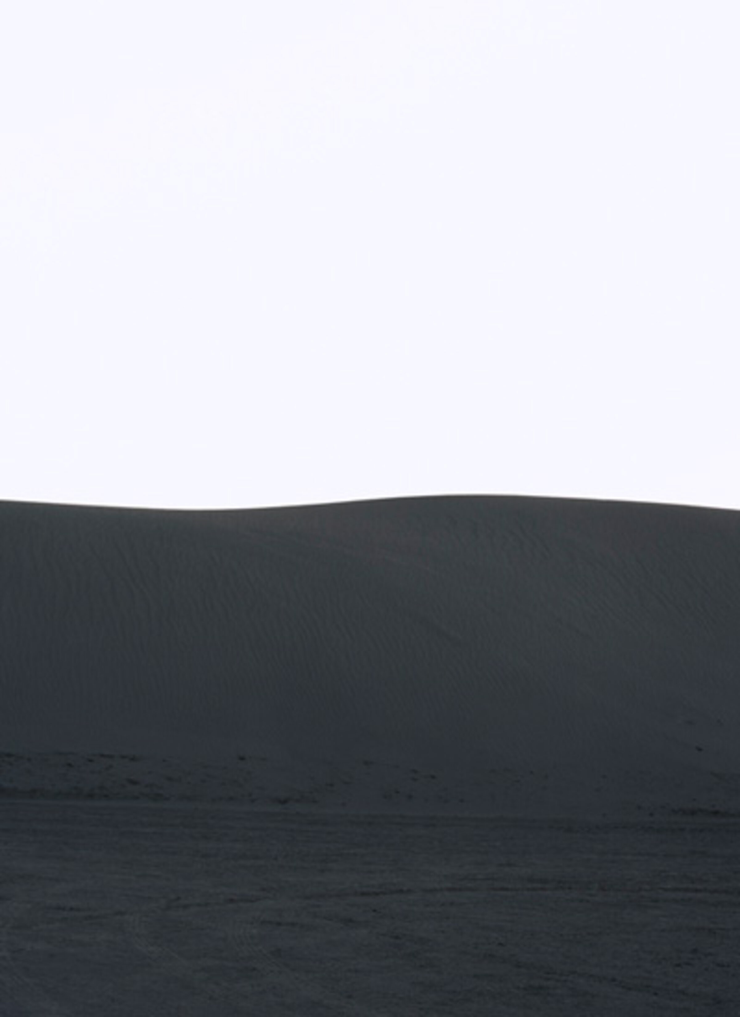 Minimalist landscape with a pale gray sky above a dark charcoal horizon line, beneath which lies a textured darker plane suggesting water or terrain, creating a stark division of tones and planes across the composition.