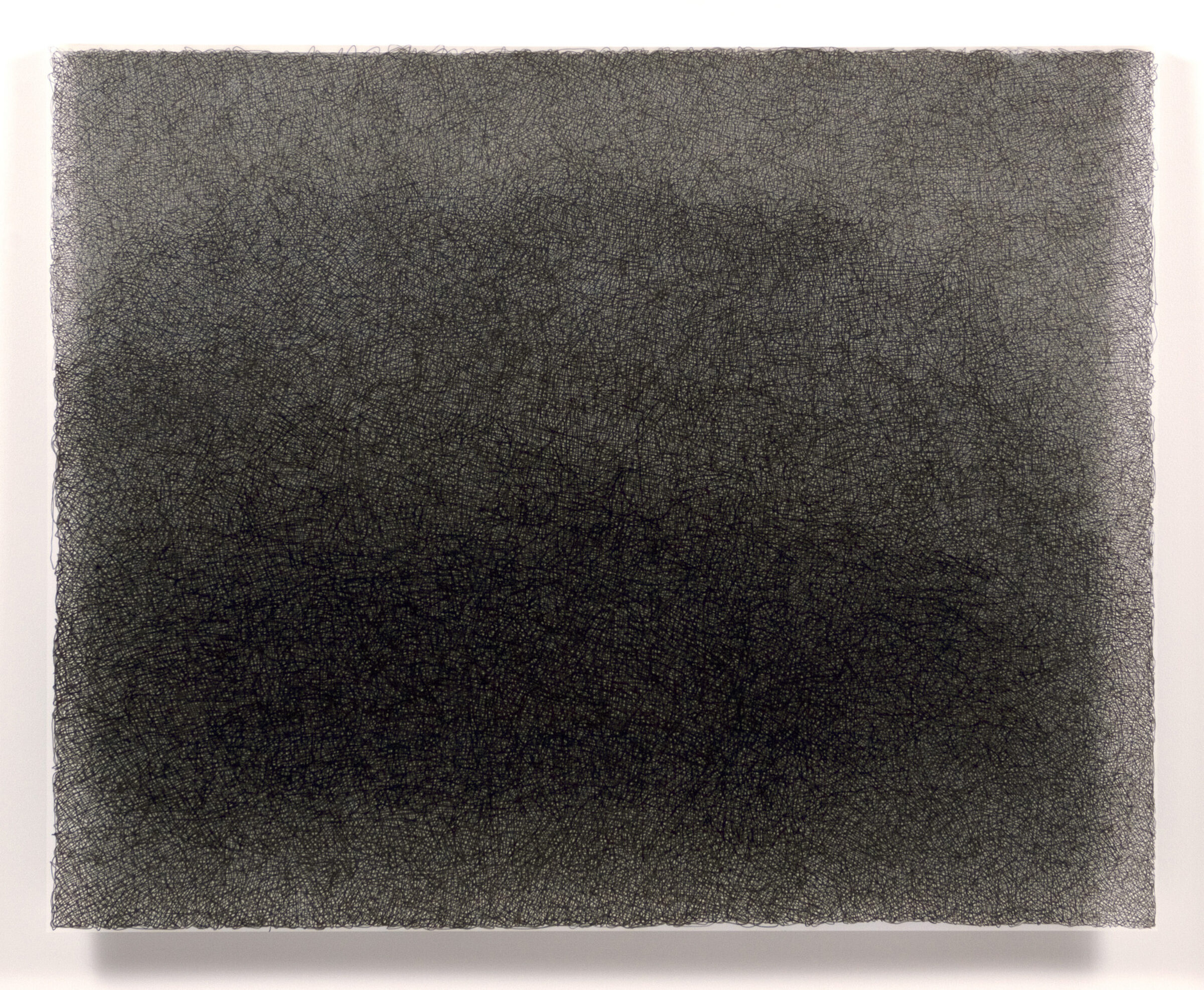 Dense field of fine, parallel horizontal lines in black and charcoal gray, creating a subtle gradation from darker tones in the center to lighter tones at the edges. The delicate crosshatching technique produces a textured, luminous surface on a rectangular composition with raw edges.