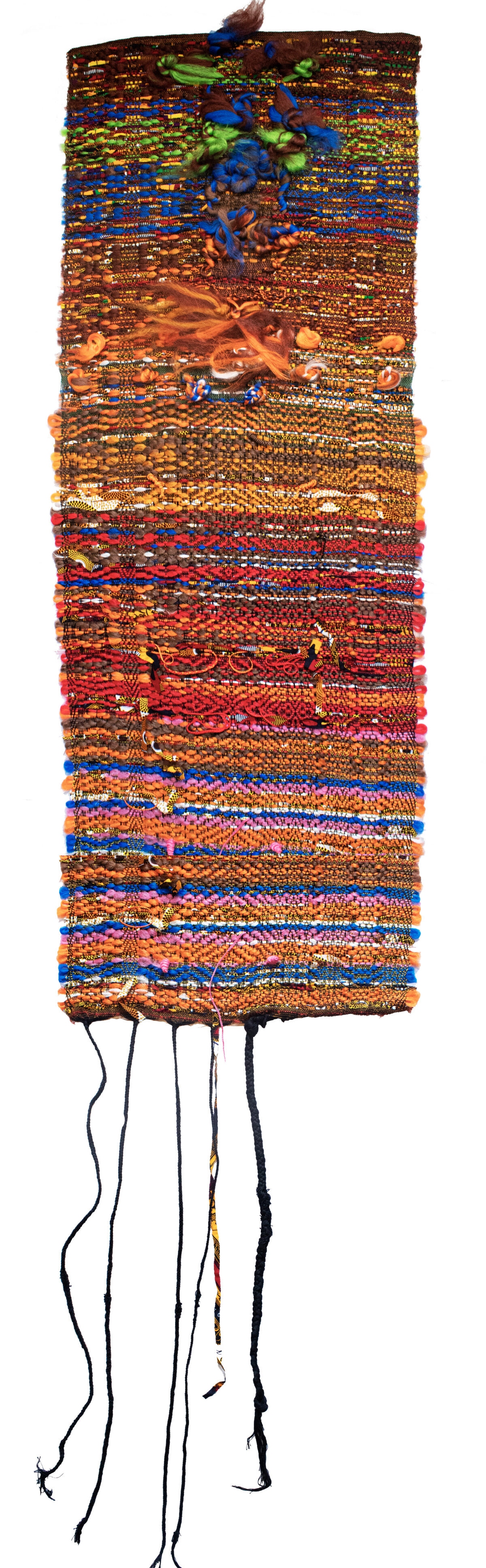 A vertical textile wall hanging composed of densely woven horizontal bands in warm and cool tones—rust, orange, gold, red, blue, and brown—with embedded synthetic fibers creating raised, textured surfaces. Three-dimensional sculptural elements in blue and green emerge from the upper portion, while dark threads dangle from the bottom edge, creating an organic, root-like appearance.