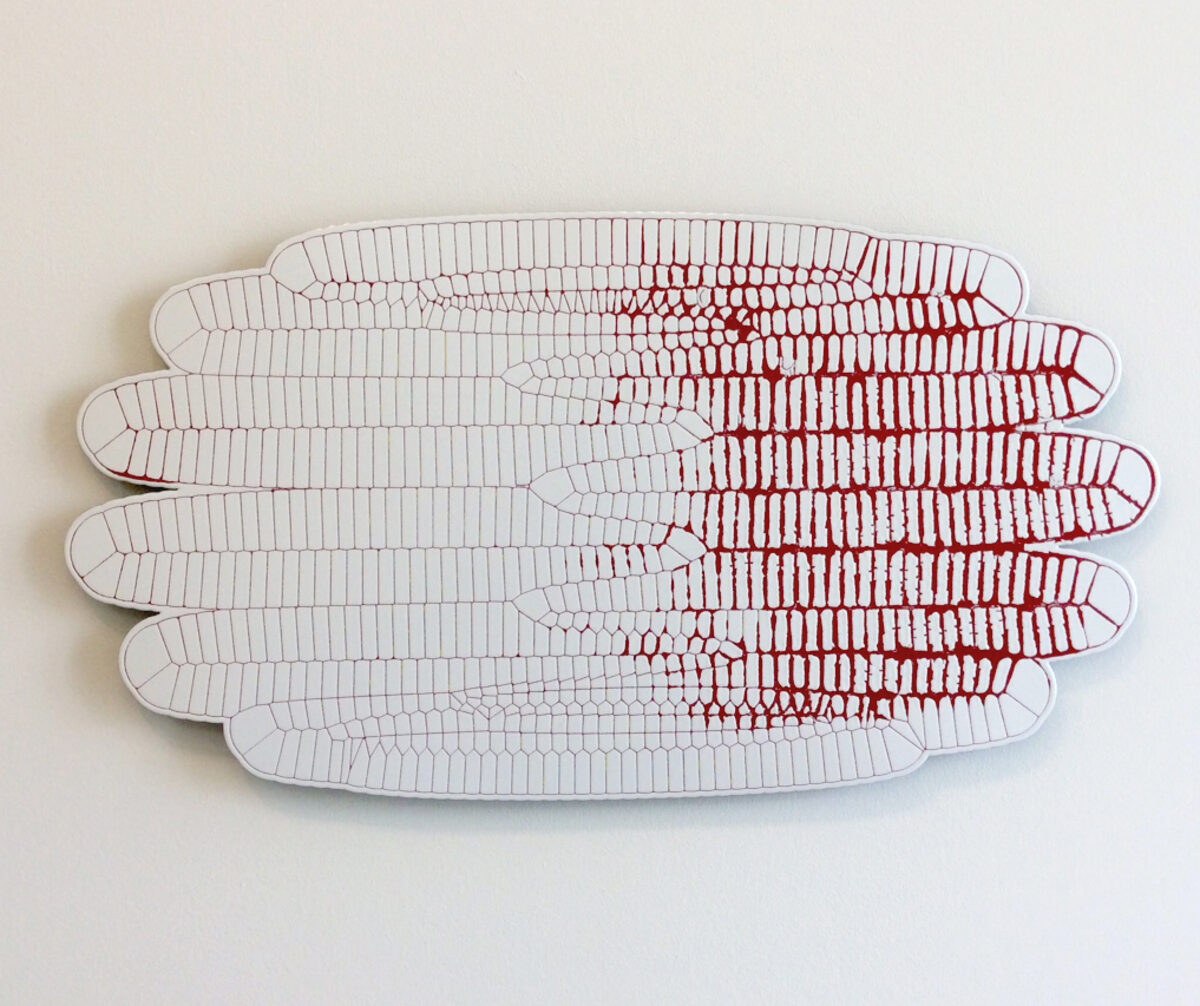 Stacked sculptural forms resembling elongated leaves or feathers rendered in white porcelain-enameled steel with linear red markings concentrated toward the center, creating a sense of depth and movement against a neutral background.