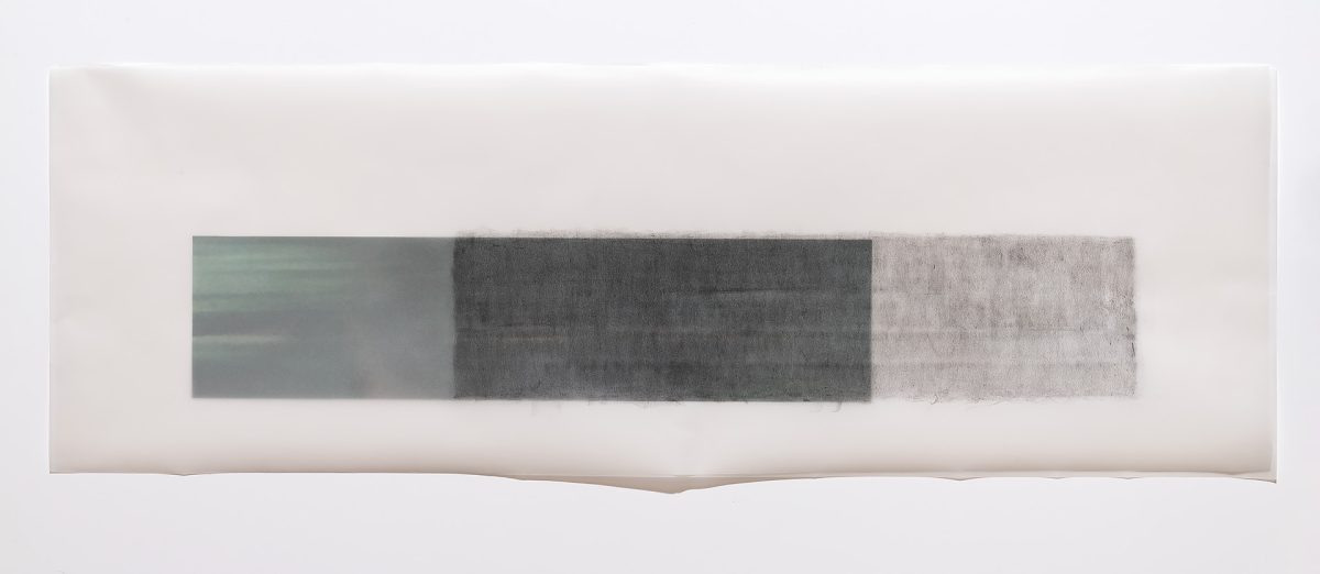 Horizontal composition featuring three rectangular panels in gradating shades of gray, from pale green-gray on the left through deep charcoal in the center to light silver-gray on the right, arranged on a cream-colored ground with subtle undulating edges.