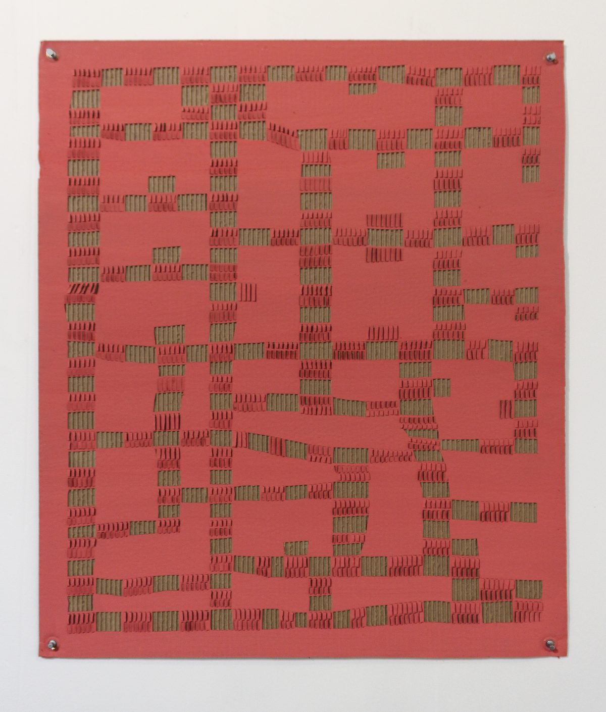 A large red square panel densely covered with hundreds of small, protruding green rectangular elements arranged in an intricate, irregular pattern across the surface. The three-dimensional components create dramatic shadows and depth, evoking a complex architectural or electronic circuit-like composition.