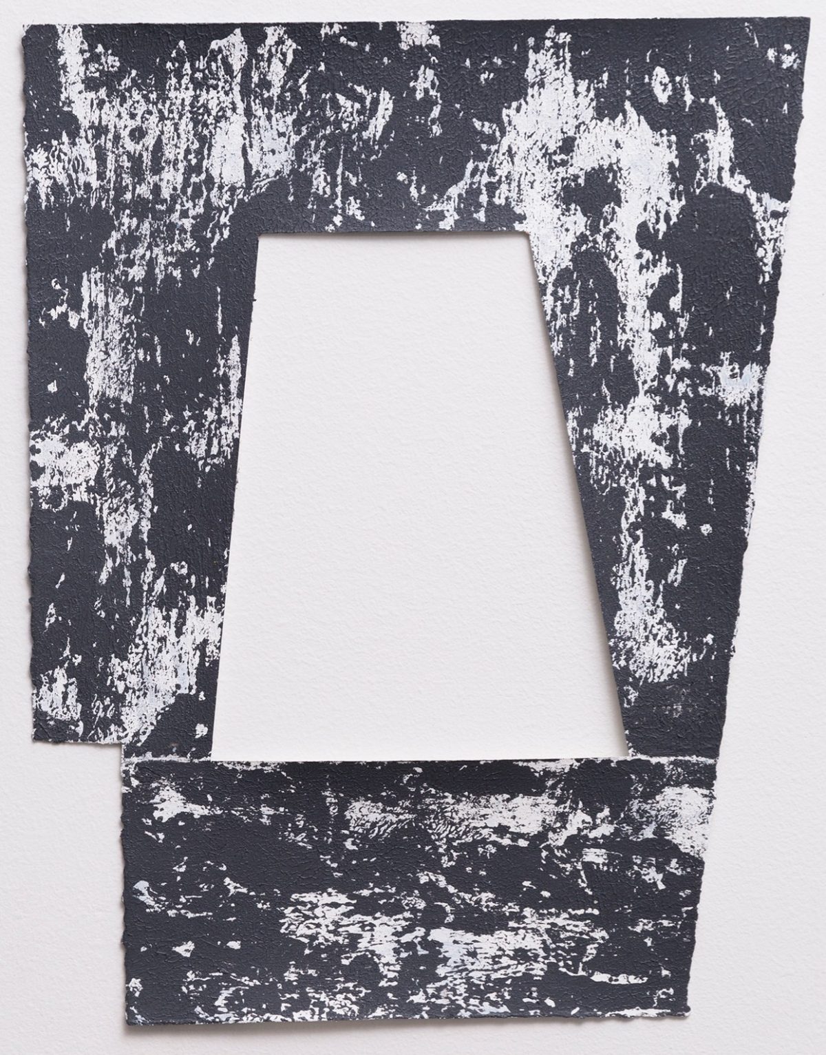 A distressed frame composition with a central white trapezoid aperture surrounded by heavily textured dark charcoal and white paint creating an aged, deteriorated surface effect. The irregular splattering and chipping across the entire work creates a sense of decay and layered abstraction.
