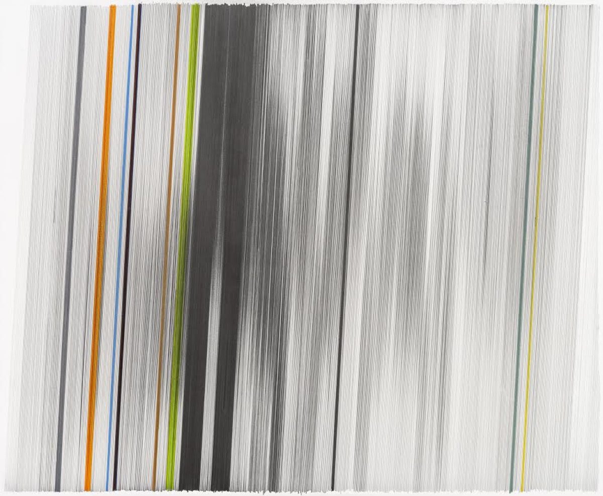 Densely layered vertical lines in graphite and colored pencil create an abstract composition, with thin streaks of orange, blue, green, and yellow punctuating the predominantly gray and white palette across the surface of mat board.