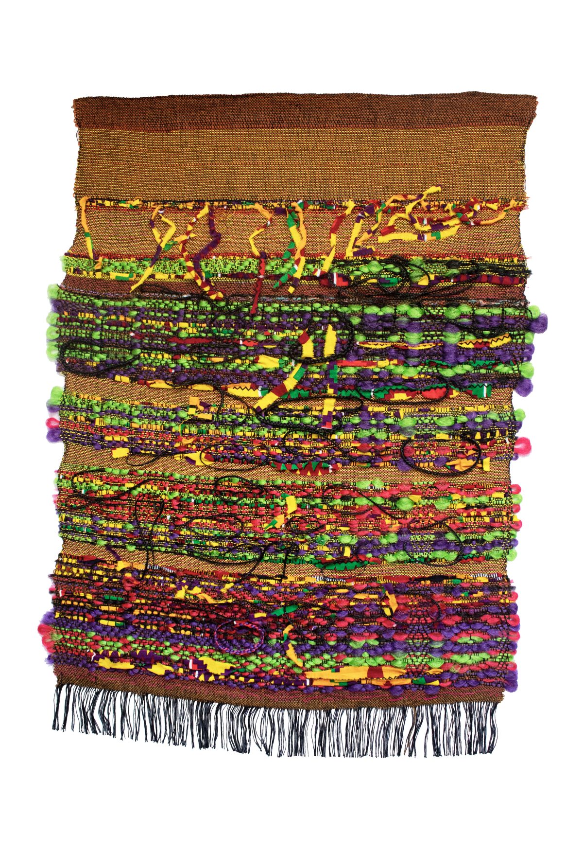 A densely layered woven textile hanging featuring vibrant horizontal stripes of contrasting colors—brilliant lime green, deep purple, rich reds, warm yellows, and earthy browns—interspersed with intricate patterned bands. Colorful pom-poms in matching hues edge the right side, while black fringe trims the bottom, creating a dynamic, energetic composition that emphasizes texture and chromatic richness.