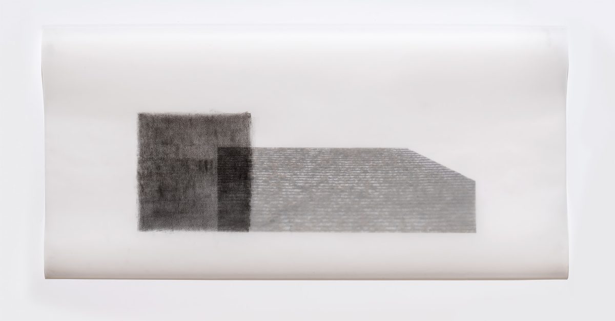 Two rectangular forms rendered in graphite on translucent vellum, positioned horizontally against a light background. The left form appears darker and more densely textured, while the right extends further with a lighter, linear pattern suggesting architectural detail or surface texture.