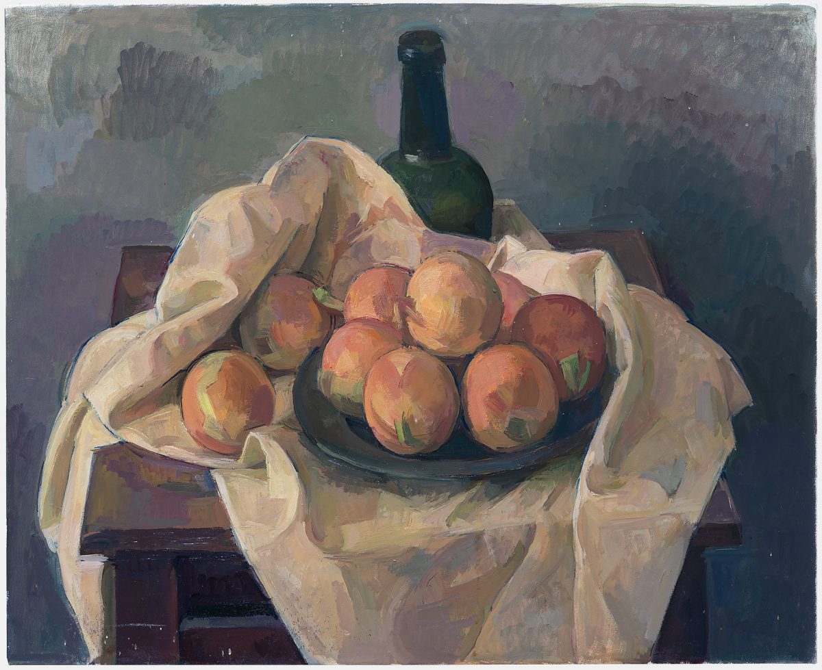 A still life composition featuring ripe peaches arranged in a dark bowl atop cream-colored draped fabric, with a dark glass bottle positioned behind. The painting employs muted earth tones and purplish shadows against a subdued background, rendered in loose, expressive brushwork.