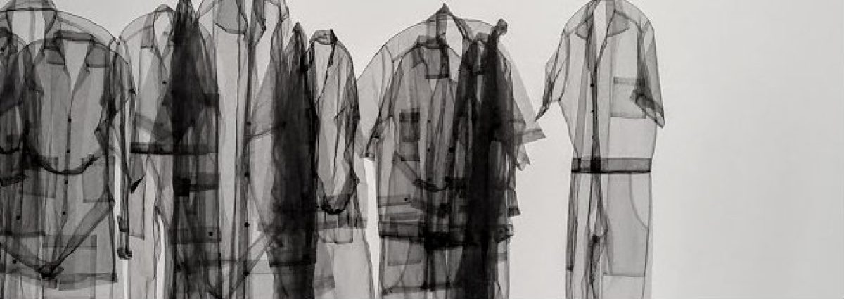 Five translucent fabric garments arranged in a row against a light background, their layered forms creating shadowy silhouettes and subtle variations in density and transparency throughout the composition.