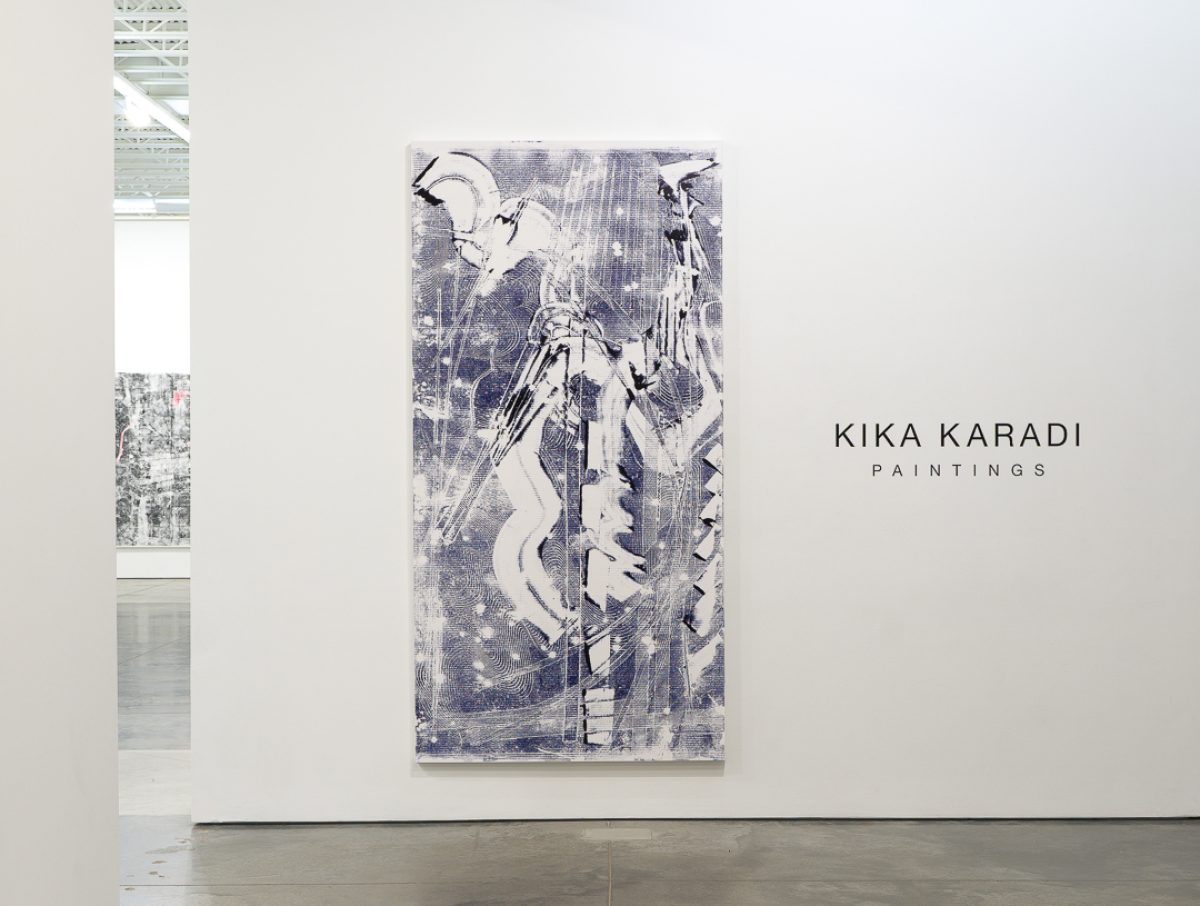 Large-scale monochromatic painting in shades of blue and white depicting an abstracted figural form with gestural marks, layered textures, and linear patterns created through stenciling and paint transfer techniques. The composition features dynamic, intersecting lines and organic shapes that create visual tension across the canvas surface.