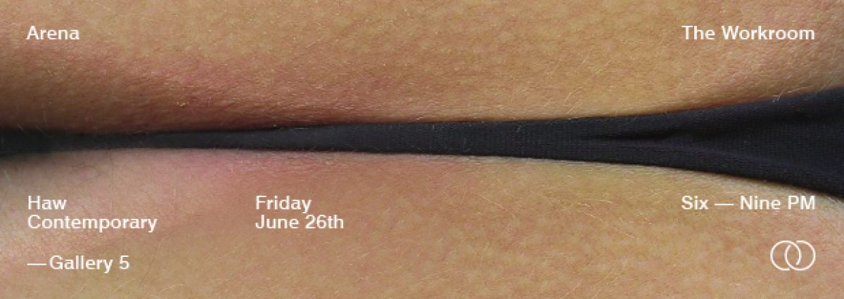 Close-up photograph of an arm showing a horizontal black line or mark across the skin, set against warm tan and peachy tones. The minimalist composition emphasizes the contrast between the dark linear element and the natural skin tones.