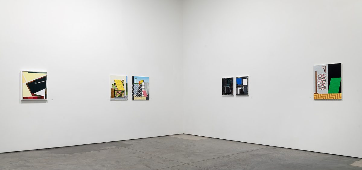 Gallery installation view showing five framed artworks arranged across a white wall above a gray floor. The works feature geometric compositions with bold colors including yellow, black, blue, green, and red, employing collage techniques and constructed spatial elements characteristic of contemporary abstract and architectural-influenced painting.