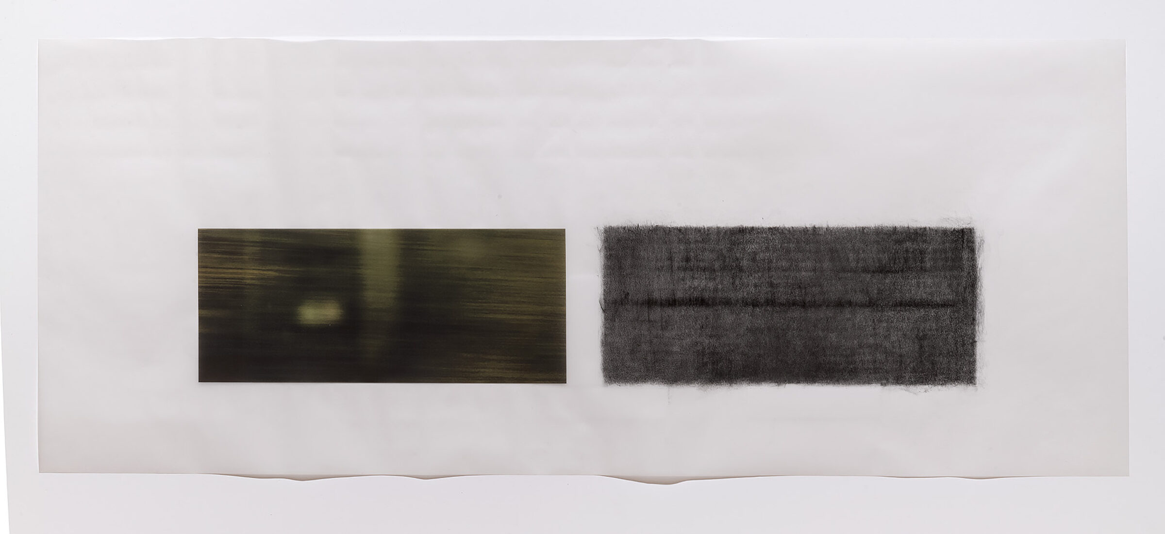 Two horizontal rectangular panels mounted on a light background. The left panel features a dark, atmospheric image with horizontal streaking and a pale central glow. The right panel shows a dense, textured dark surface with a grainy, rubbed quality. Both works demonstrate muted tones in charcoal and olive-brown hues.