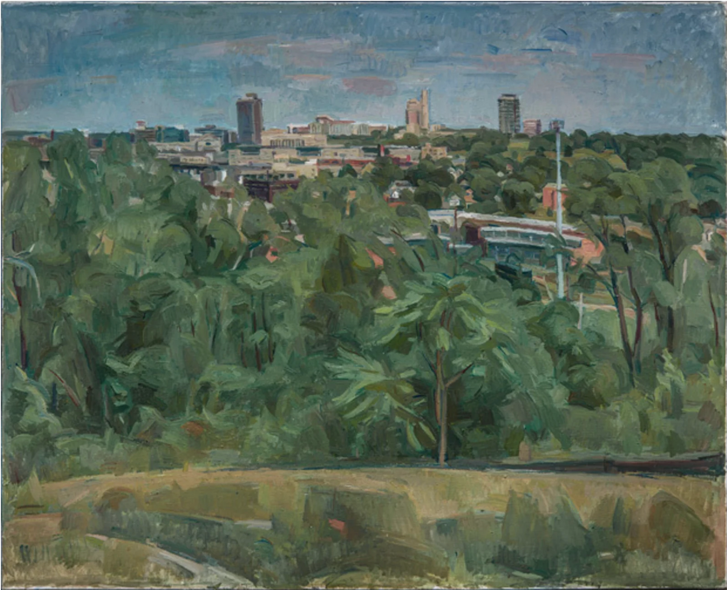 A cityscape viewed across a lush, verdant foreground of trees and vegetation. The composition stretches from densely rendered green foliage in the immediate foreground to a distant urban skyline dominated by mid-rise buildings and church spires. The painting employs muted blues and greens with warm tan and brick tones, rendered in loose, expressive brushwork characteristic of early modernist landscape painting.