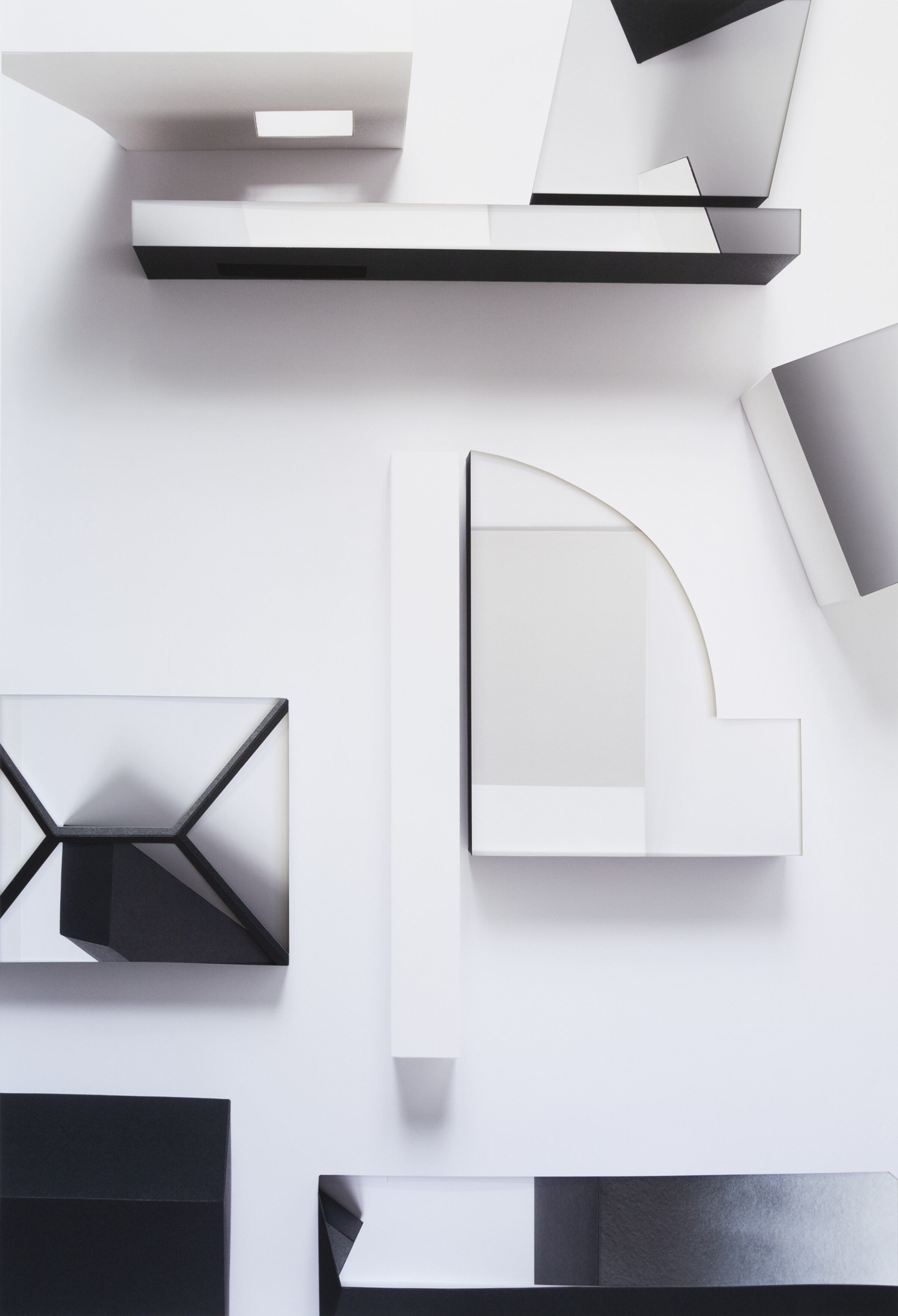 Abstract composition of layered geometric forms in black and white, featuring overlapping rectangular and curved shapes arranged across a light background. Shadowing and depth create a three-dimensional effect suggesting deconstructed architectural elements.