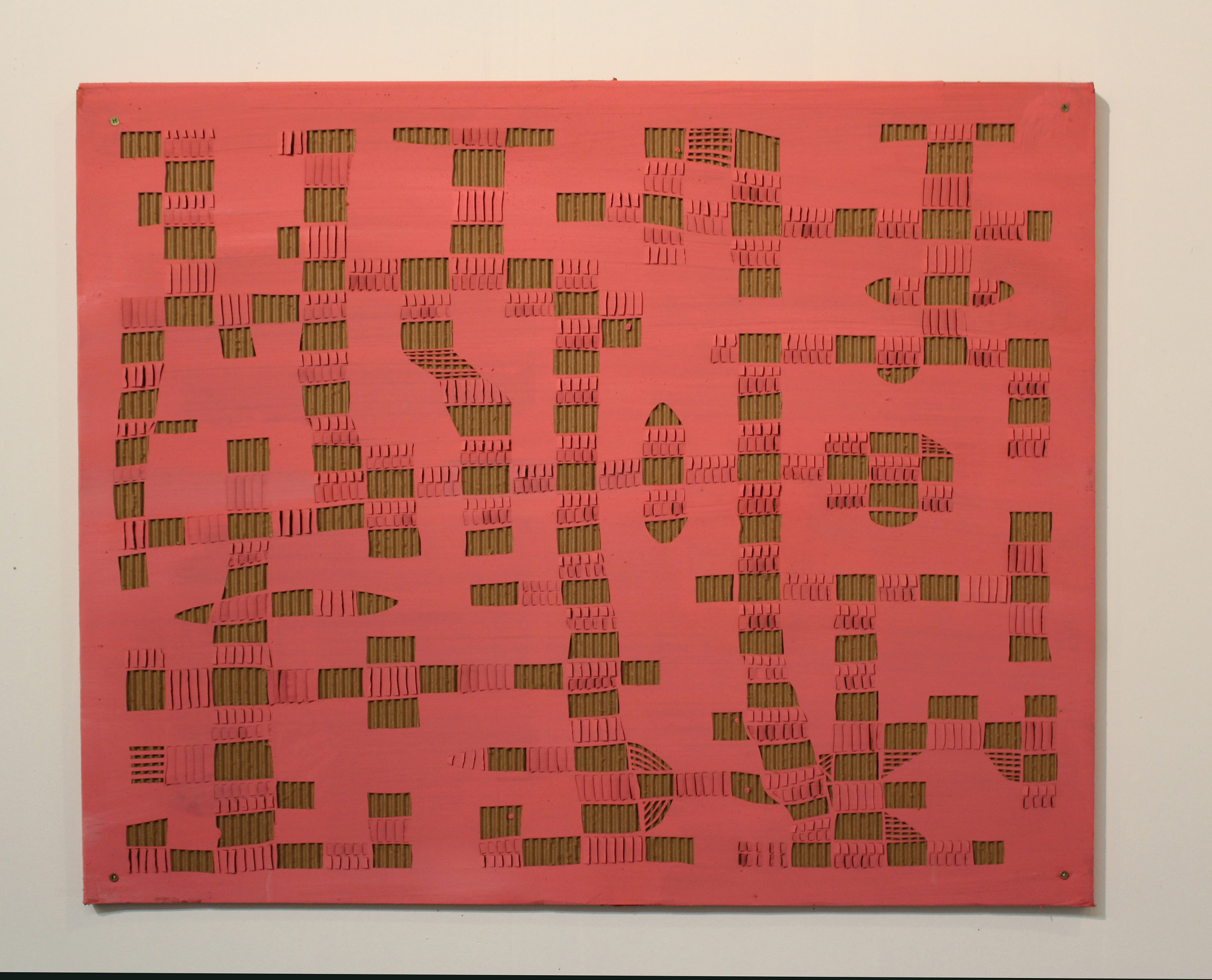 A bright coral-red cardboard panel densely covered with cut and layered rectangular shapes in olive green and pink tones, creating an abstract, fragmented composition that suggests circuitry or architectural elements.
