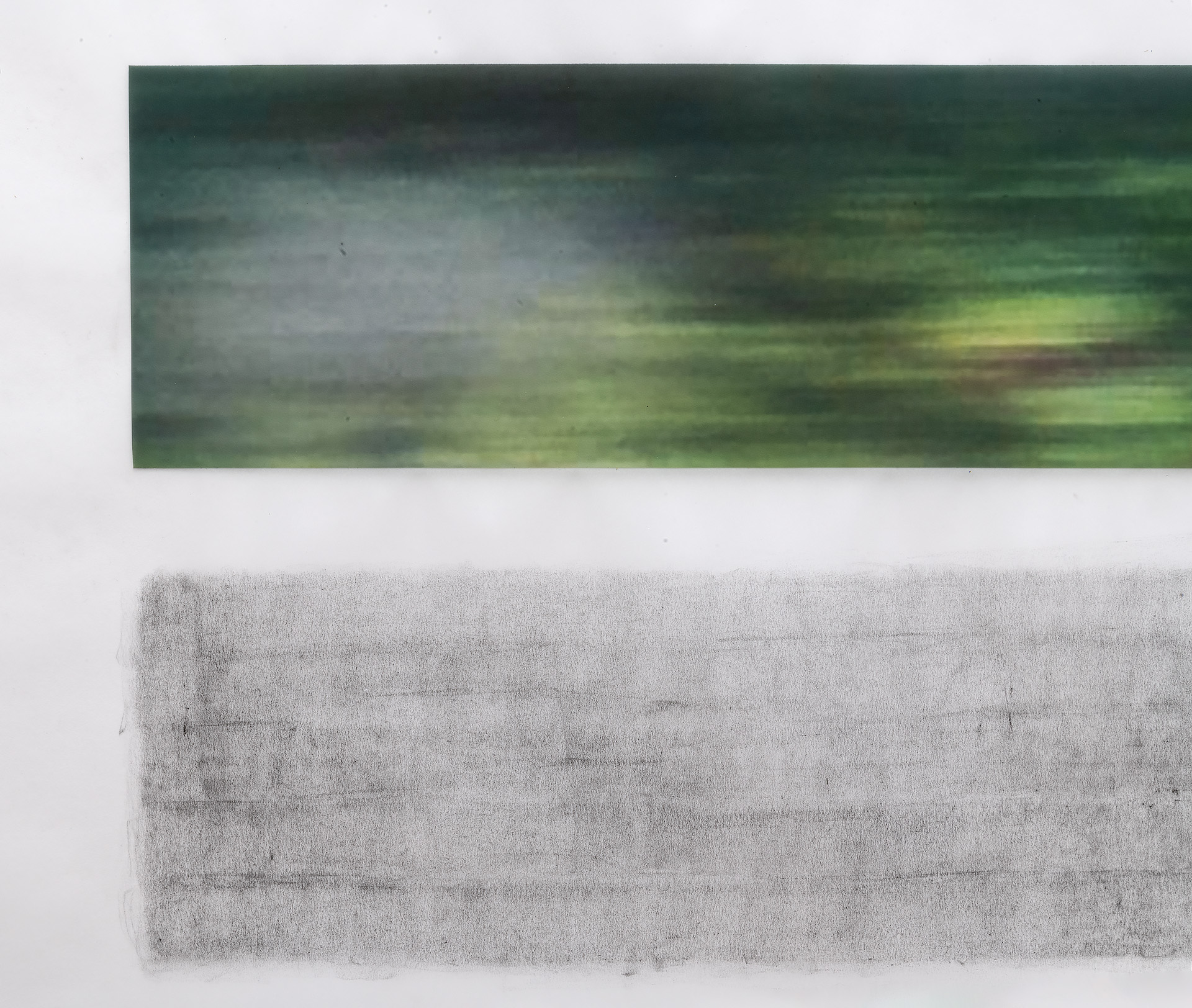 Two horizontal rectangular panels mounted on a white wall. The upper panel displays soft, blurred horizontal bands of green, gray, and yellow tones suggesting a landscape seen through motion or abstraction. The lower panel is a textured gray rubbing with visible linear marks and variations in tone, creating a weathered, organic surface.