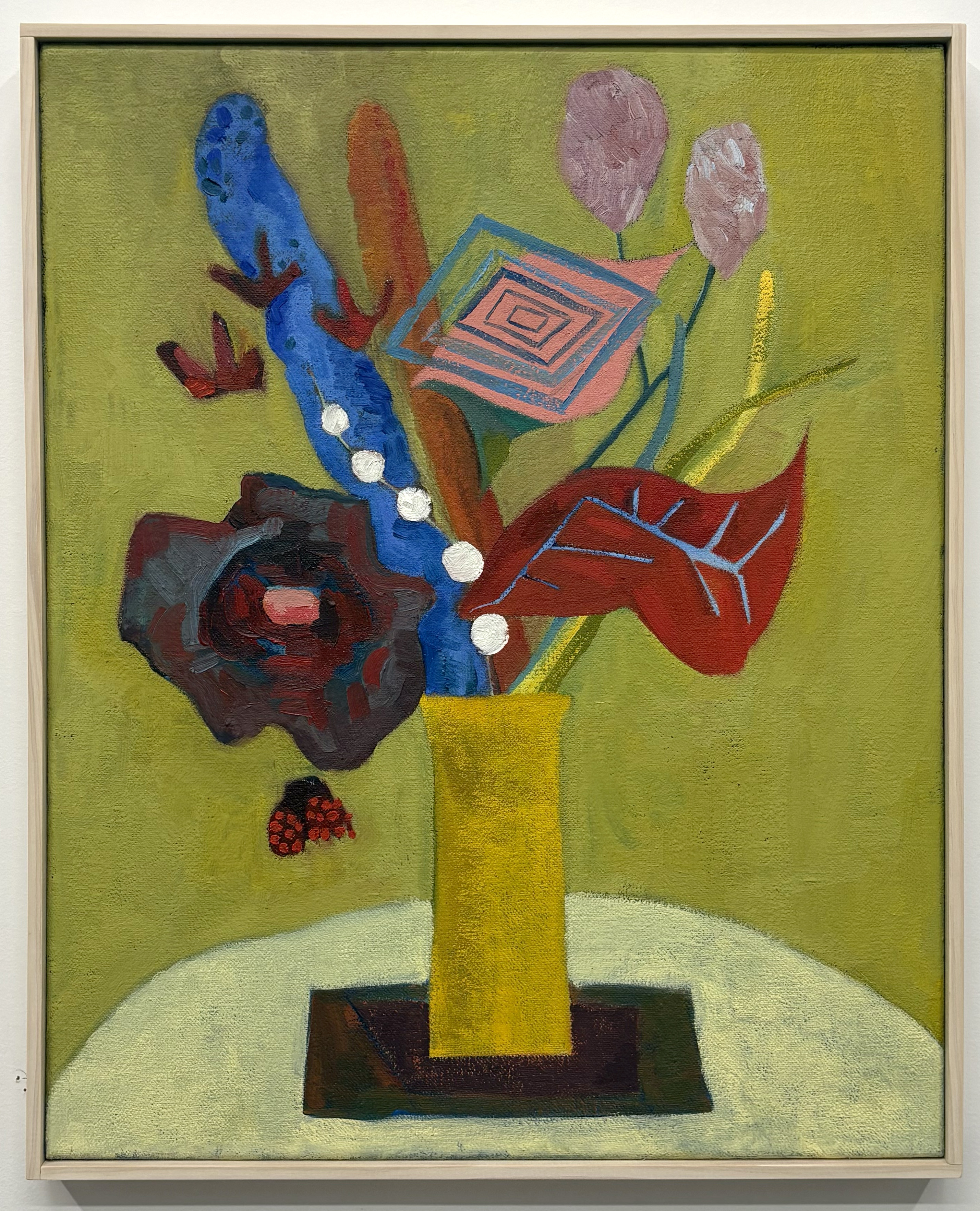 A vibrant oil painting featuring an abstract floral arrangement in a yellow vase against a chartreuse background. The composition includes stylized flowers and botanical forms rendered in bold blues, reds, purples, and earth tones, with geometric patterns and white dotted details creating visual rhythm throughout the composition.
