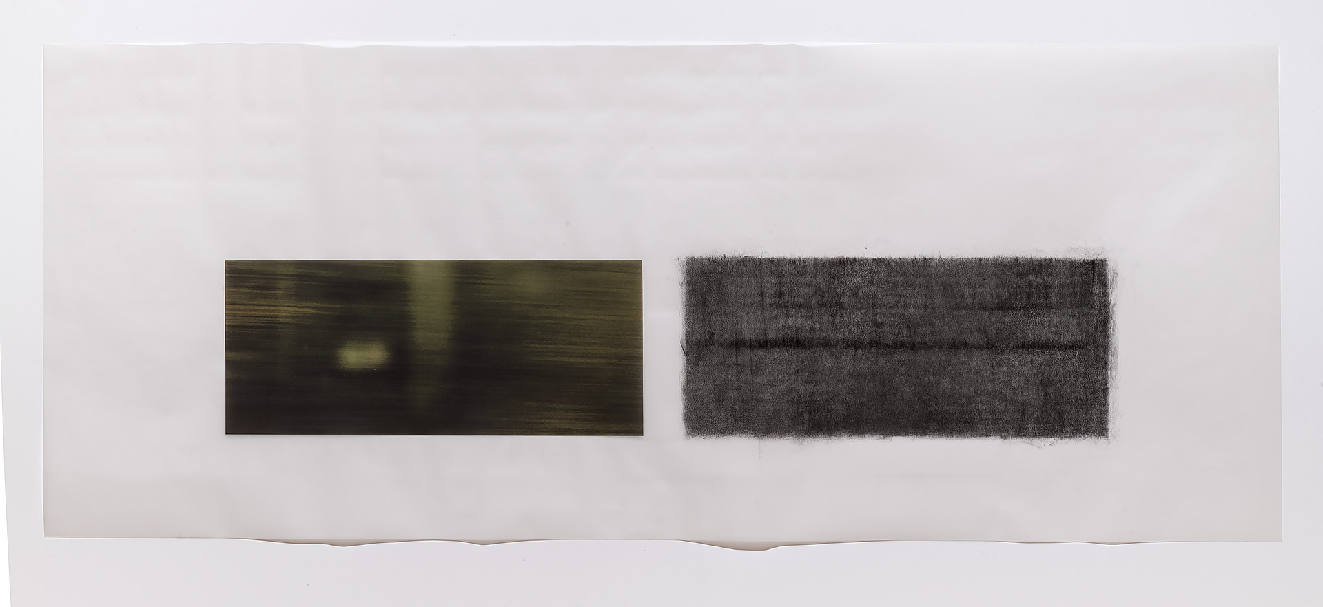 Two horizontal rectangular panels mounted on a light background. The left panel features a dark, atmospheric image with horizontal streaking and a pale central glow. The right panel shows a dense, textured dark surface with a grainy, rubbed quality. Both works demonstrate muted tones in charcoal and olive-brown hues.