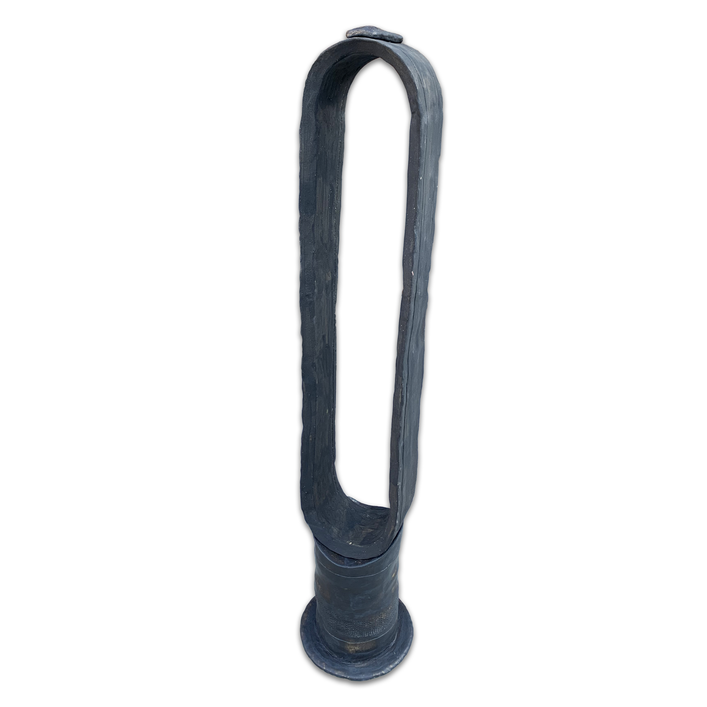 A tall, narrow sculptural form with a cylindrical base and elongated loop top, rendered in dark blue-gray glazed clay with a matte finish. The closed loop creates a minimalist, abstract silhouette against a white background.
