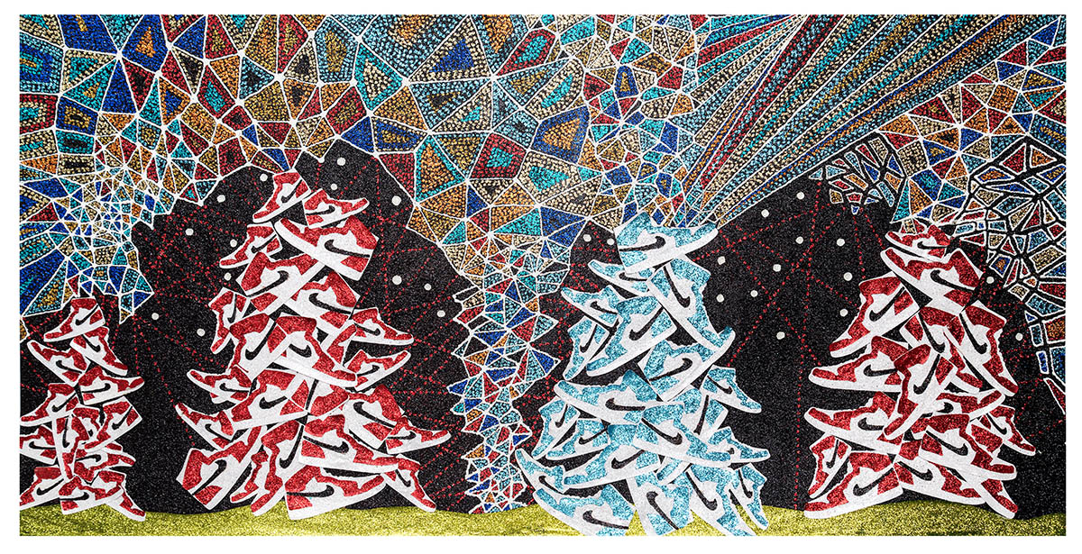Stylized evergreen trees rendered in red, white, and turquoise arranged in stacked formation against a dark background, with an ornate geometric mosaic pattern in jewel tones filling the upper portion and a lime green ground at the base. The composition features layered cut paper elements with glittery textures and intricate linear details throughout.