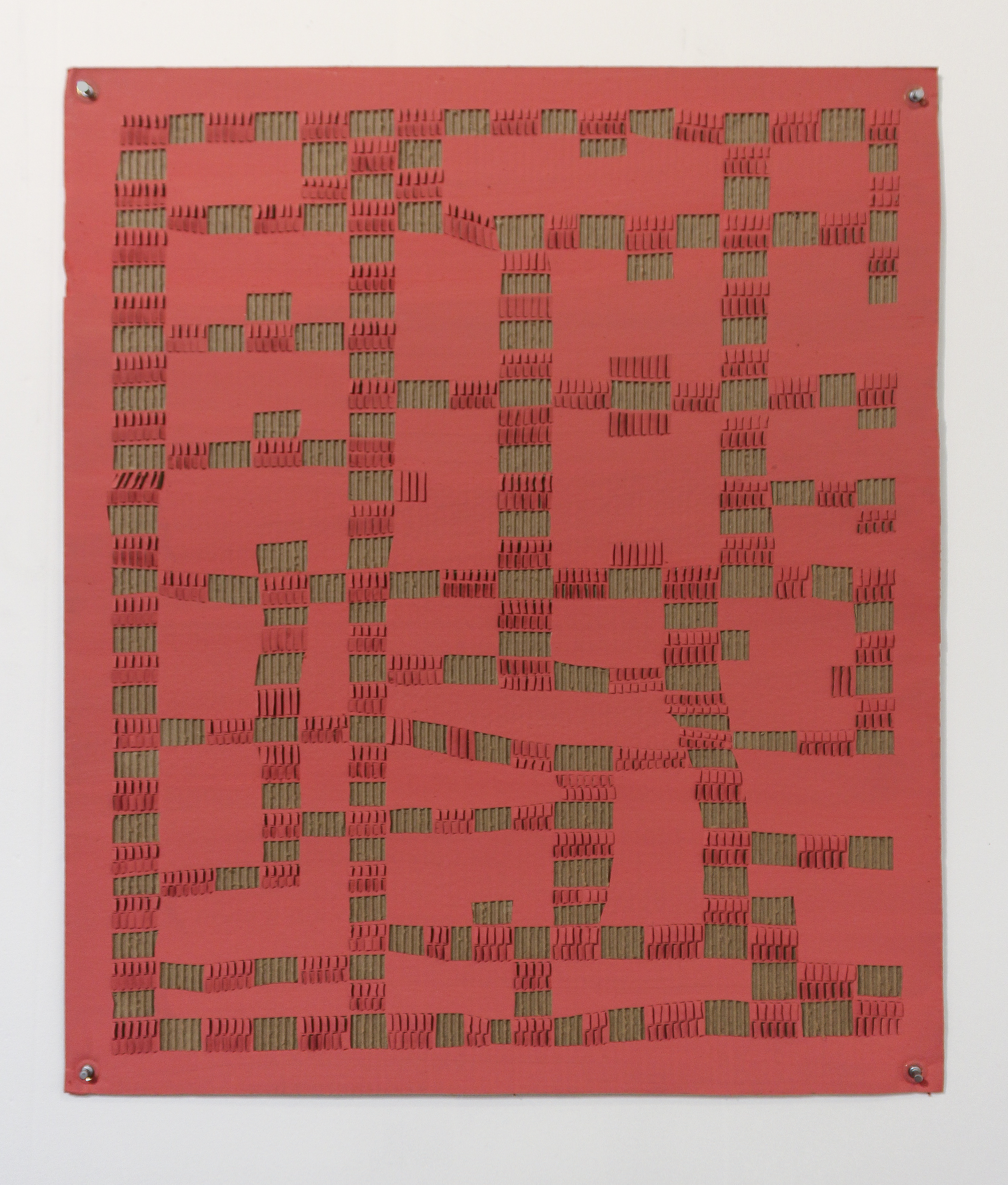 A large red square panel densely covered with hundreds of small, protruding green rectangular elements arranged in an intricate, irregular pattern across the surface. The three-dimensional components create dramatic shadows and depth, evoking a complex architectural or electronic circuit-like composition.