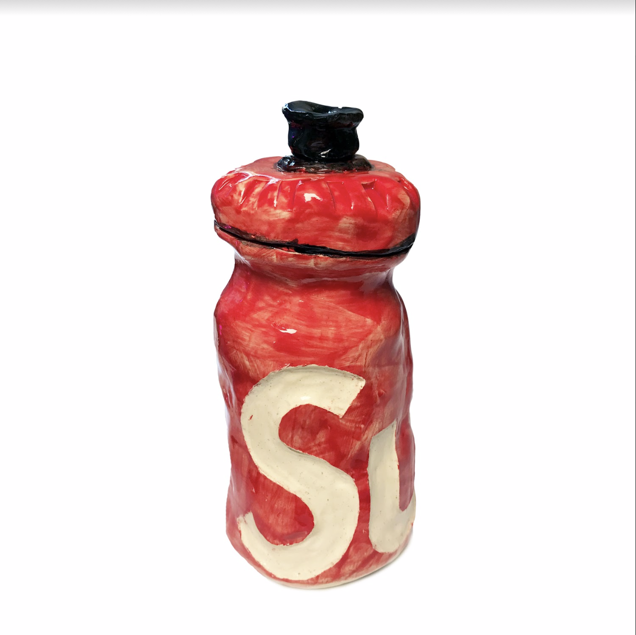 A ceramic water bottle rendered in bright red glaze with cream-colored lettering, featuring a black glazed stopper at the top. The cylindrical form is decorated with a bold "S" and partial letter on its surface, set against a white background.