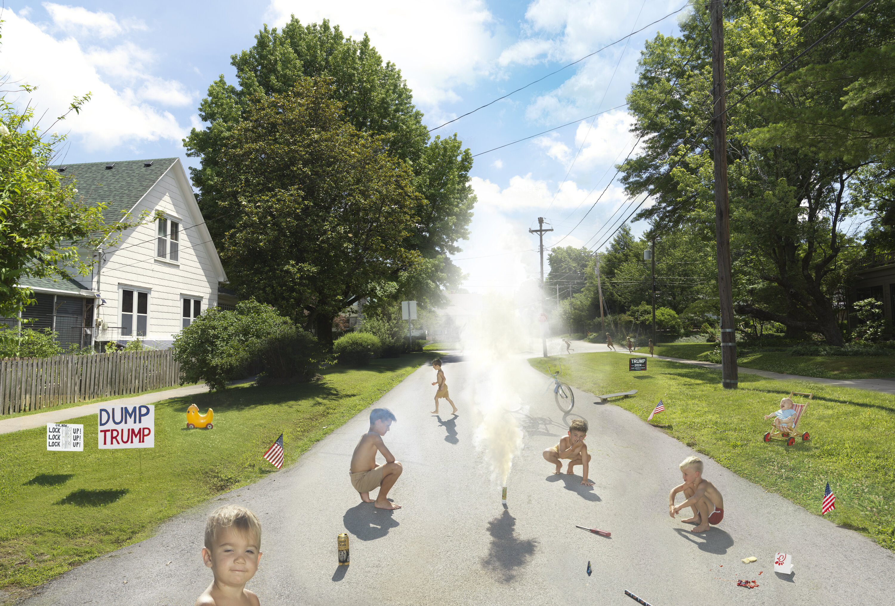 A suburban street scene with children playing among smoke, some crouching or running while others ride bicycles. A white house with a picket fence sits on the left lawn displaying political signage, while green lawns, tall trees, and utility poles line both sides of the tree-canopied road under a partly cloudy sky.