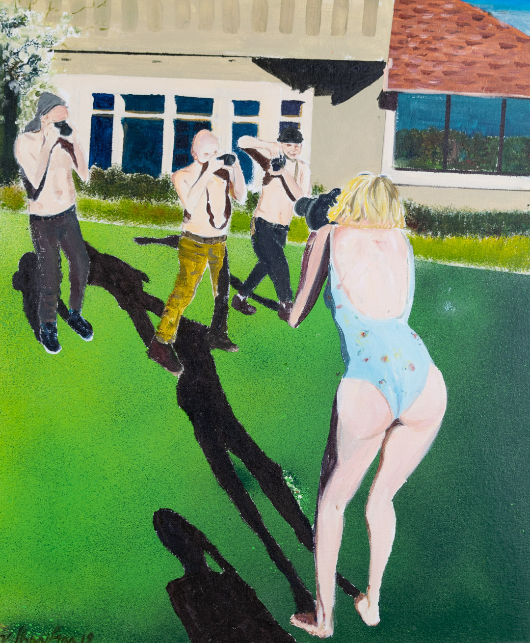 A figure in a light blue swimsuit stands in the foreground of a bright green lawn, facing away from the viewer. Behind them, three shirtless figures in dark pants hold cameras, photographing the scene. A modernist residential building with blue-framed windows and a brick chimney occupies the background. The composition uses bold, flat areas of color—vivid green grass, cream-colored walls, and dark shadows—rendered in a stylized, figurative manner.