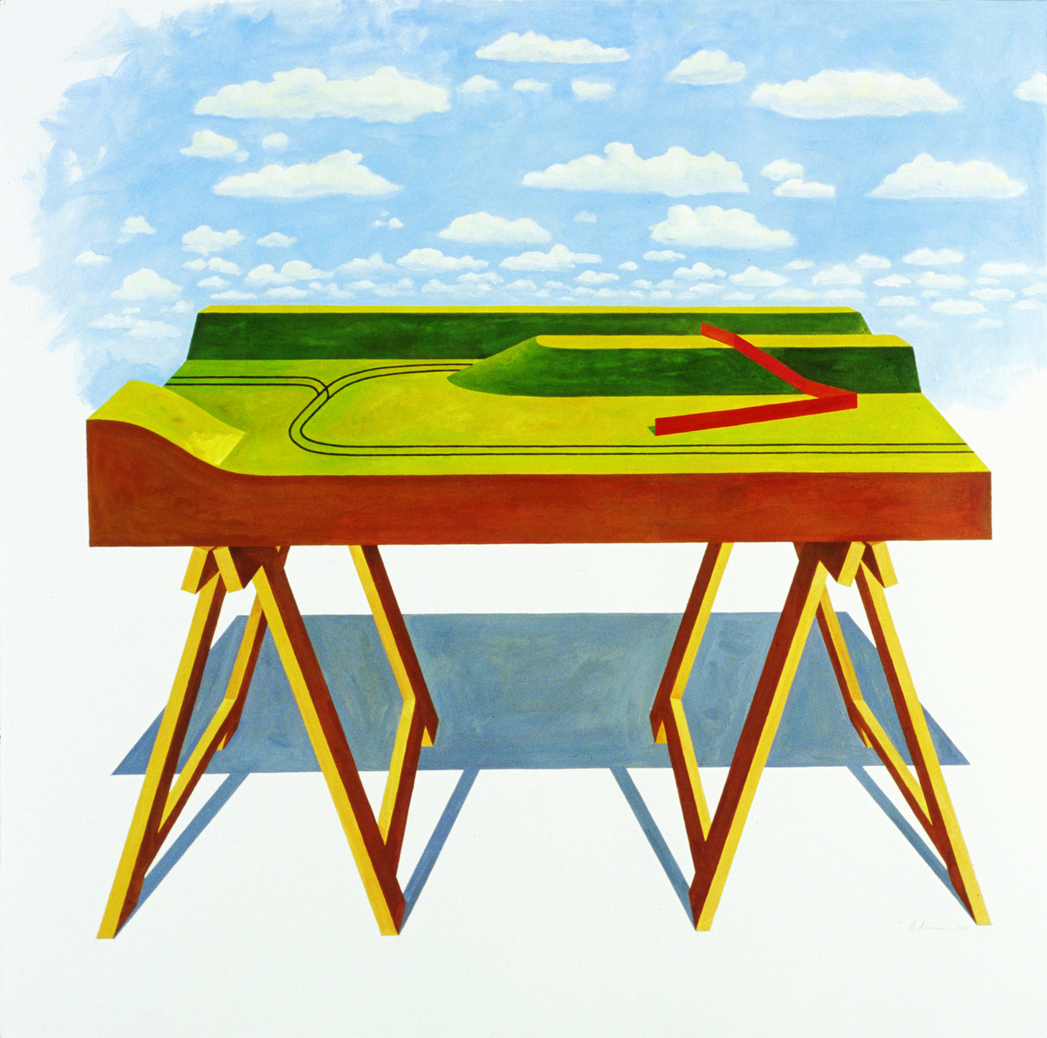 A geometric landscape rendered in bold primary colors sits atop a sawhorse-style support structure. Layered sections of green and yellow represent rolling terrain with a curved path and red directional arrow, set against a bright blue sky filled with white clouds.