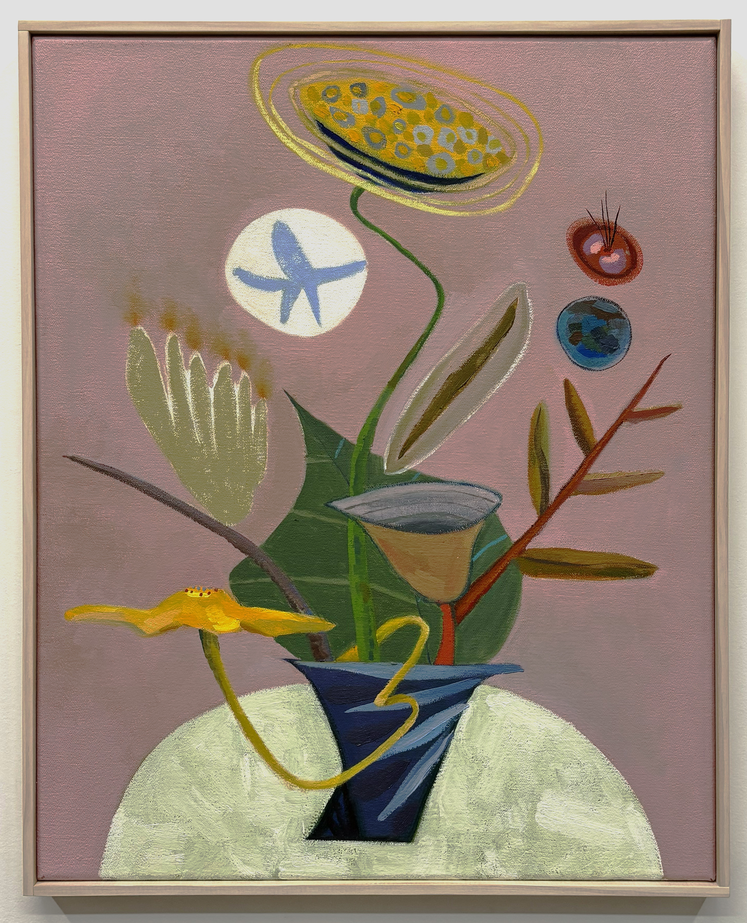 An abstract still life painting featuring a stylized potted plant with green stems and leaves arranged in a dark blue vase set against a pale semicircular base. The composition includes a yellow curved form, a tan funnel-shaped vessel, and red branches with small buds. Floating above are whimsical elements: a yellow oval with dotted patterns, a white circle containing a blue starfish, and two small spherical forms in rust and turquoise, all set against a muted mauve background.
