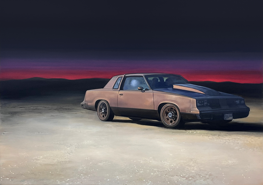 A two-tone sedan sits on a desert plain beneath a dramatic twilight sky of deep purple and crimson. The car's metallic finish reflects the sunset glow, creating a contemplative scene that merges nostalgic Americana with stark, barren landscape.