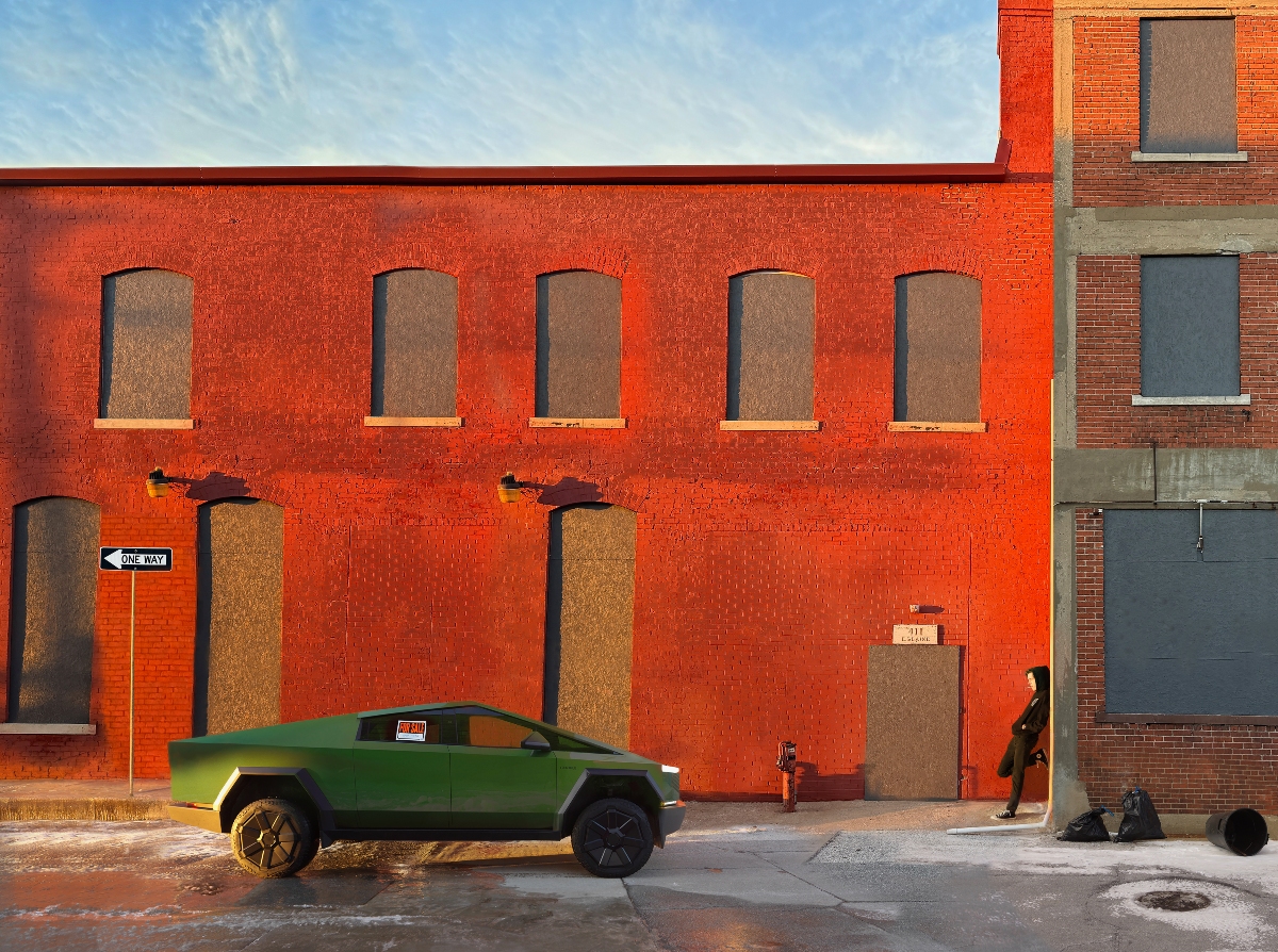 A green angular vehicle parks in front of a striking red brick building with boarded-up arched windows. A solitary figure stands nearby on the sidewalk under clear blue sky, with a fire hydrant and scattered objects visible in the composition.