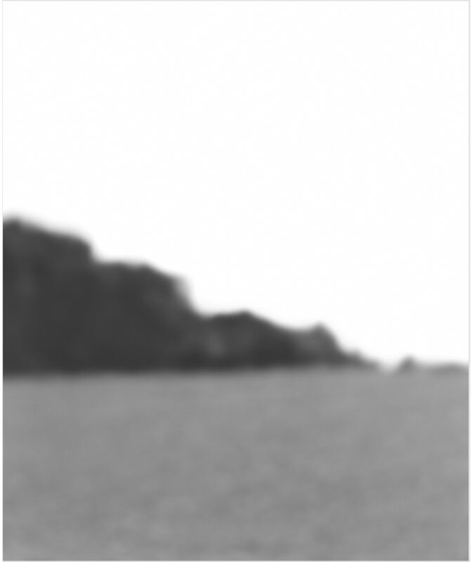 A minimalist landscape with a dark silhouetted hillside or treeline across the upper portion against a lighter sky, with a misty gray foreground. The soft focus and grainy texture suggest an analog photographic process.