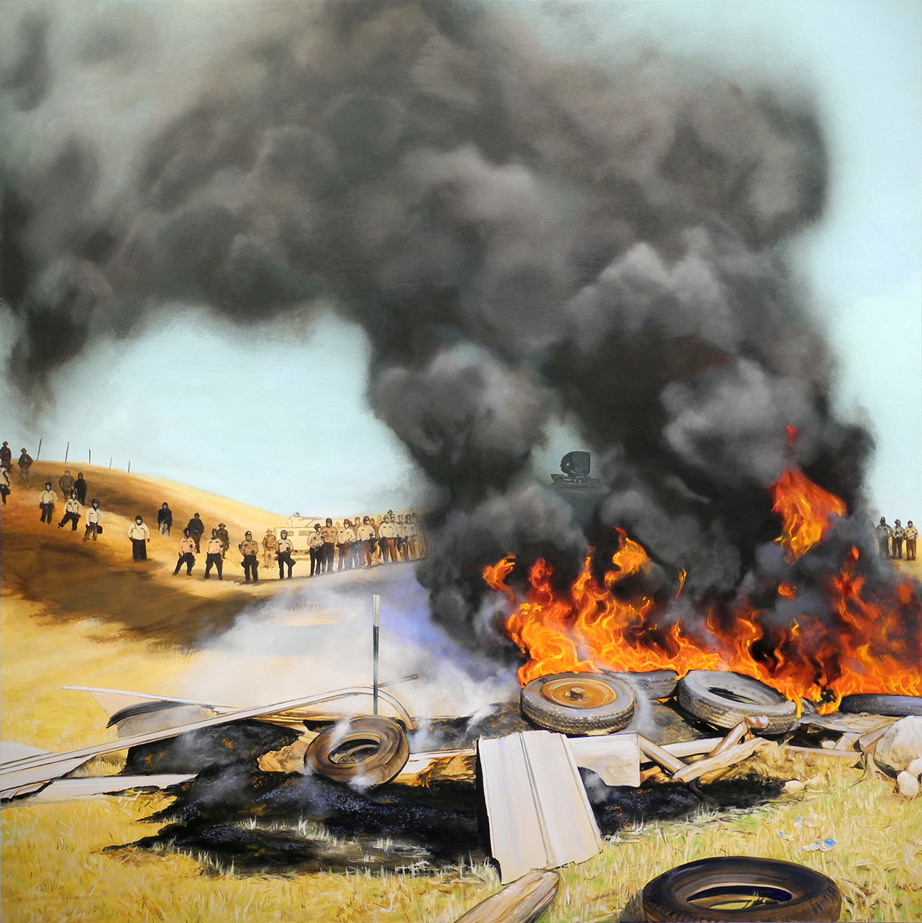 A landscape painting depicting a large bonfire with blazing flames and billowing black smoke in the foreground, surrounded by burning tires and wooden debris. In the background, figures stand on a sandy hillside overlooking the scene. The composition contrasts the warm golden tones of the dry terrain with the intense oranges and reds of the fire and the dark, roiling smoke above.