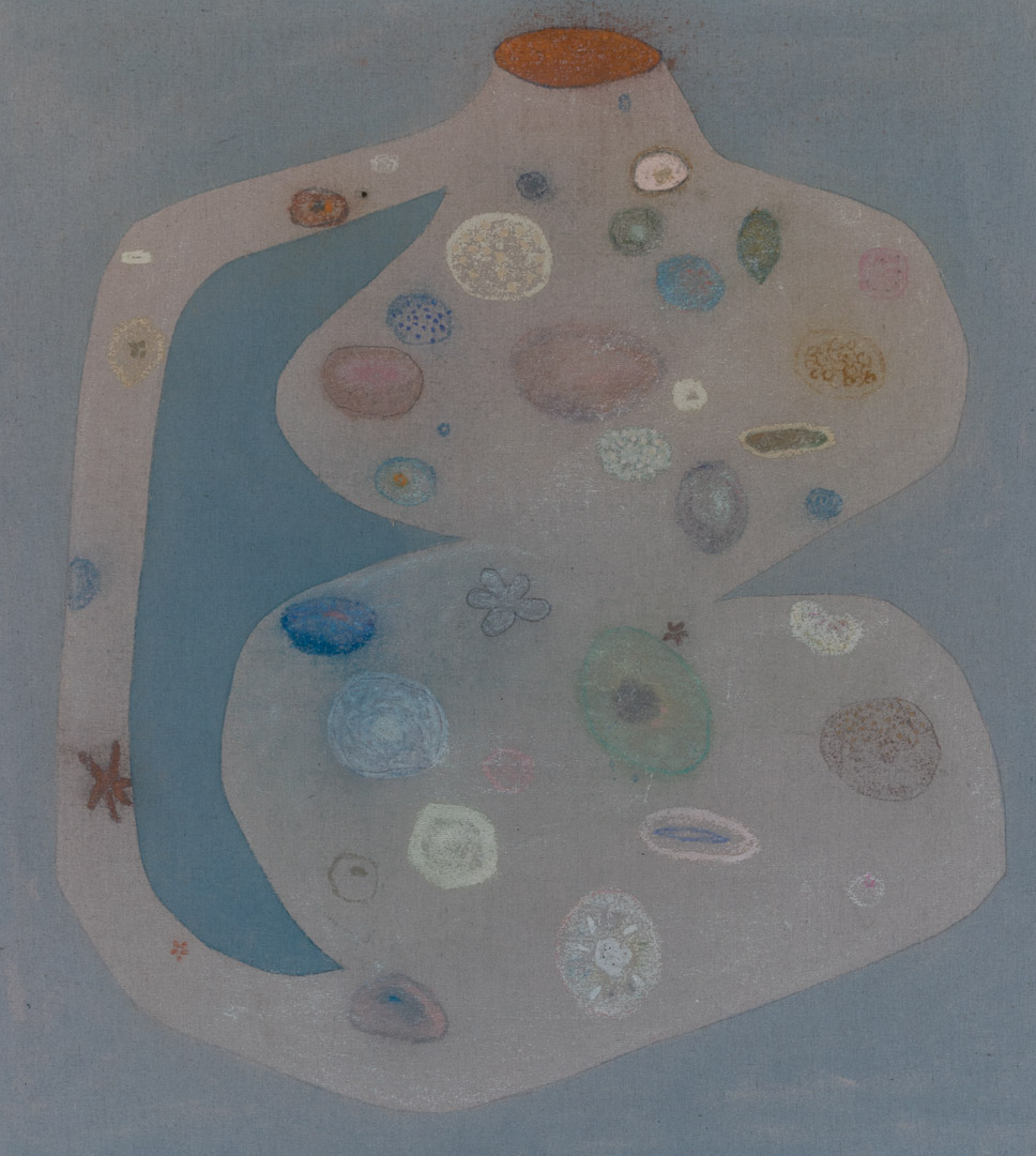 Abstract composition featuring a pale mauve-pink organic form against a soft blue-gray background, with a darker teal curved shape cutting through the center. The surface is densely populated with varied circular and oval forms in muted colors—cream, dusty blue, sage green, rose, and ochre—creating a cellular or microscopic quality. A narrow arm extends from the upper left with additional small marks scattered along its length.