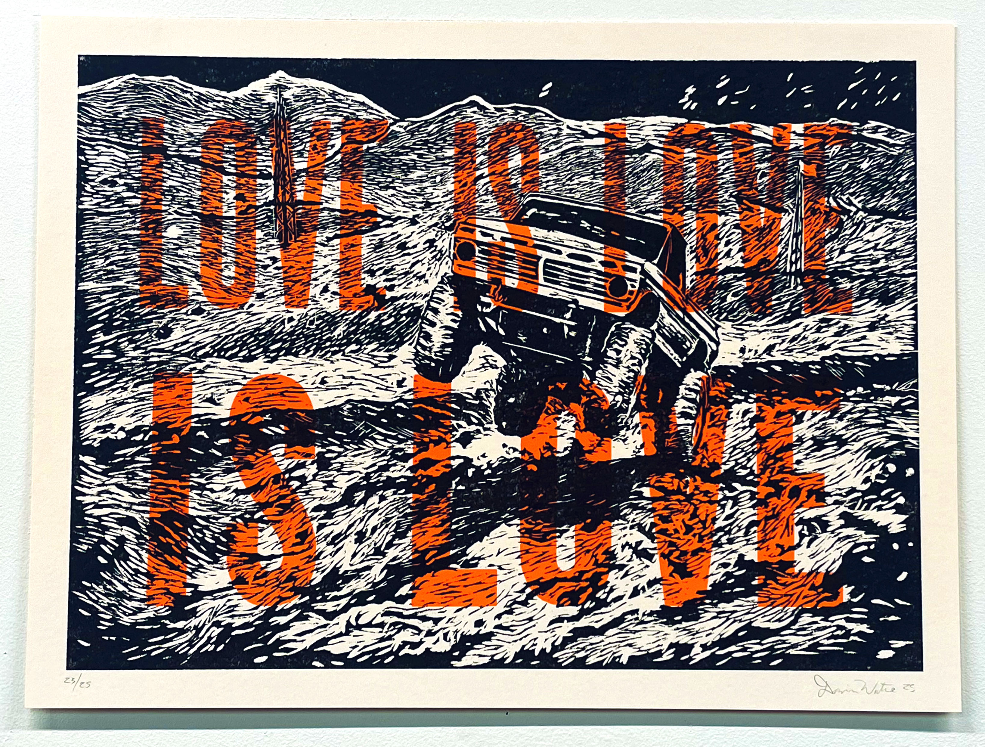 A woodcut print in black, white, orange, and brown depicts a rugged vehicle navigating a desert landscape marked by bold striped patterns. The composition features layered mountains in the background and expressive linear hatching throughout, creating dynamic movement across the composition.