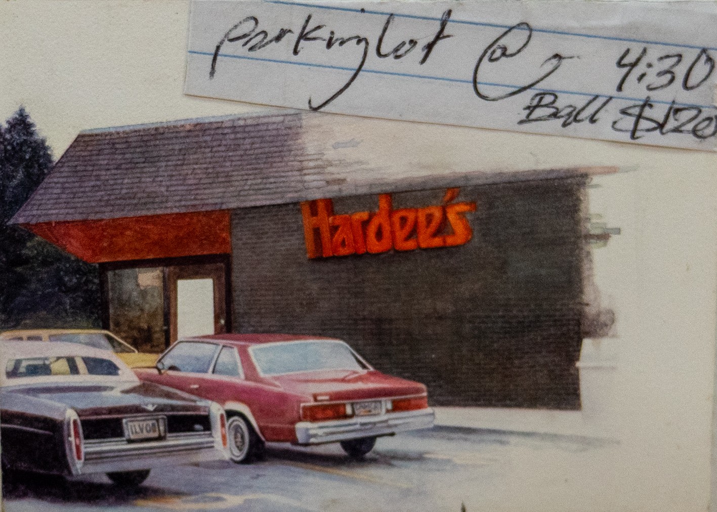Watercolor painting of a brick commercial building with red awning and "Hardee's" signage in orange lettering, depicted with three parked sedans in the foreground parking lot. Handwritten notes visible at top of the work surface.