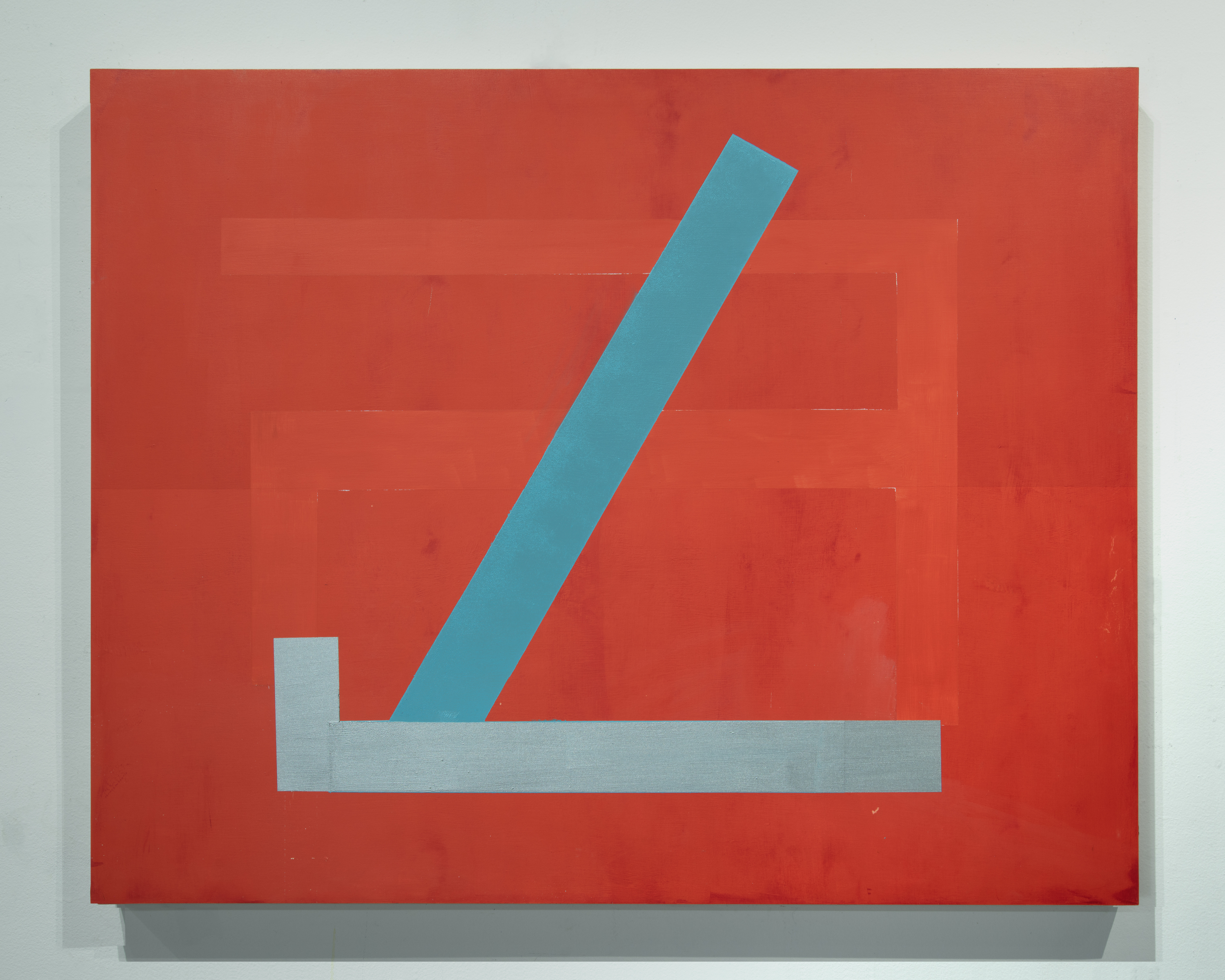 A geometric abstract composition on a red ground featuring a light gray horizontal rectangle intersected by a teal diagonal bar that extends upward to the upper right. The painted forms create a stark, minimalist composition with crisp edges against the warm red background.