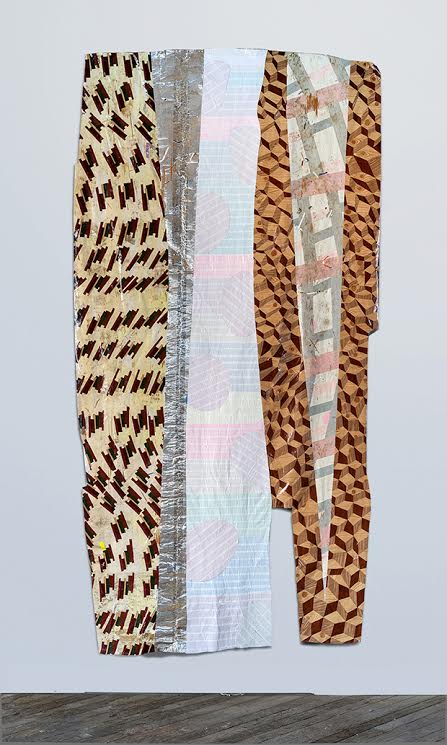 Vertical composition of layered fabric strips and tape in brown, cream, and white tones, featuring geometric patterns including diagonal lines and checkered designs, arranged in a draped formation against a white wall.