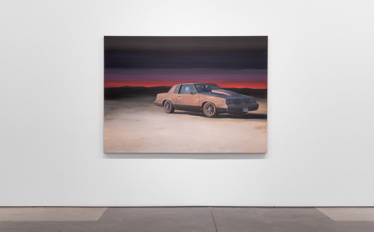 A vintage muscle car with racing stripes sits alone on a vast desert plain beneath a dramatic twilight sky transitioning from deep purple to burnt orange and red on the horizon. The painting employs layered, textured brushwork to create an atmospheric landscape that evokes isolation and contemplation.