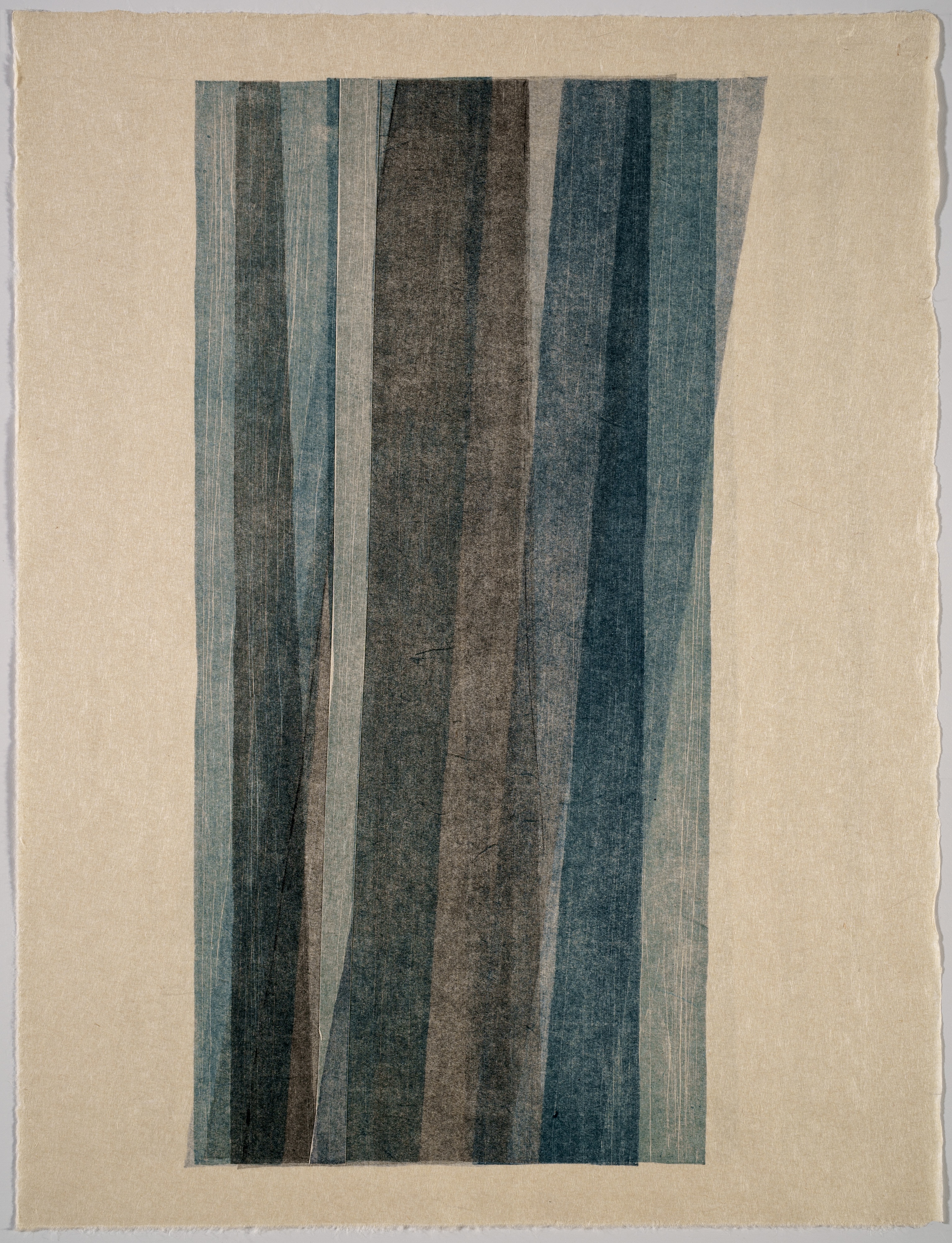 Vertical composition of overlapping vertical stripes in muted tones of blue, gray, brown, and green on a cream-colored background. The stripes vary in width and opacity, creating a subtle rhythm of light and shadow with a textured, handmade quality.