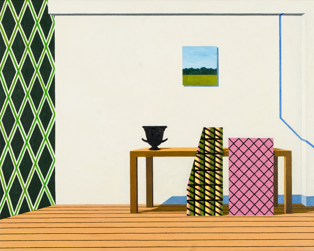 A staged interior composition featuring a wooden floor and cream-colored wall decorated with a green and yellow diamond-patterned panel on the left. A wooden table displays a black classical urn, flanked by geometric forms in black-and-yellow stripes and pink quilted patterns. A landscape painting depicting a yellow field and tree line hangs above, while a blue architectural element frames the upper right corner.